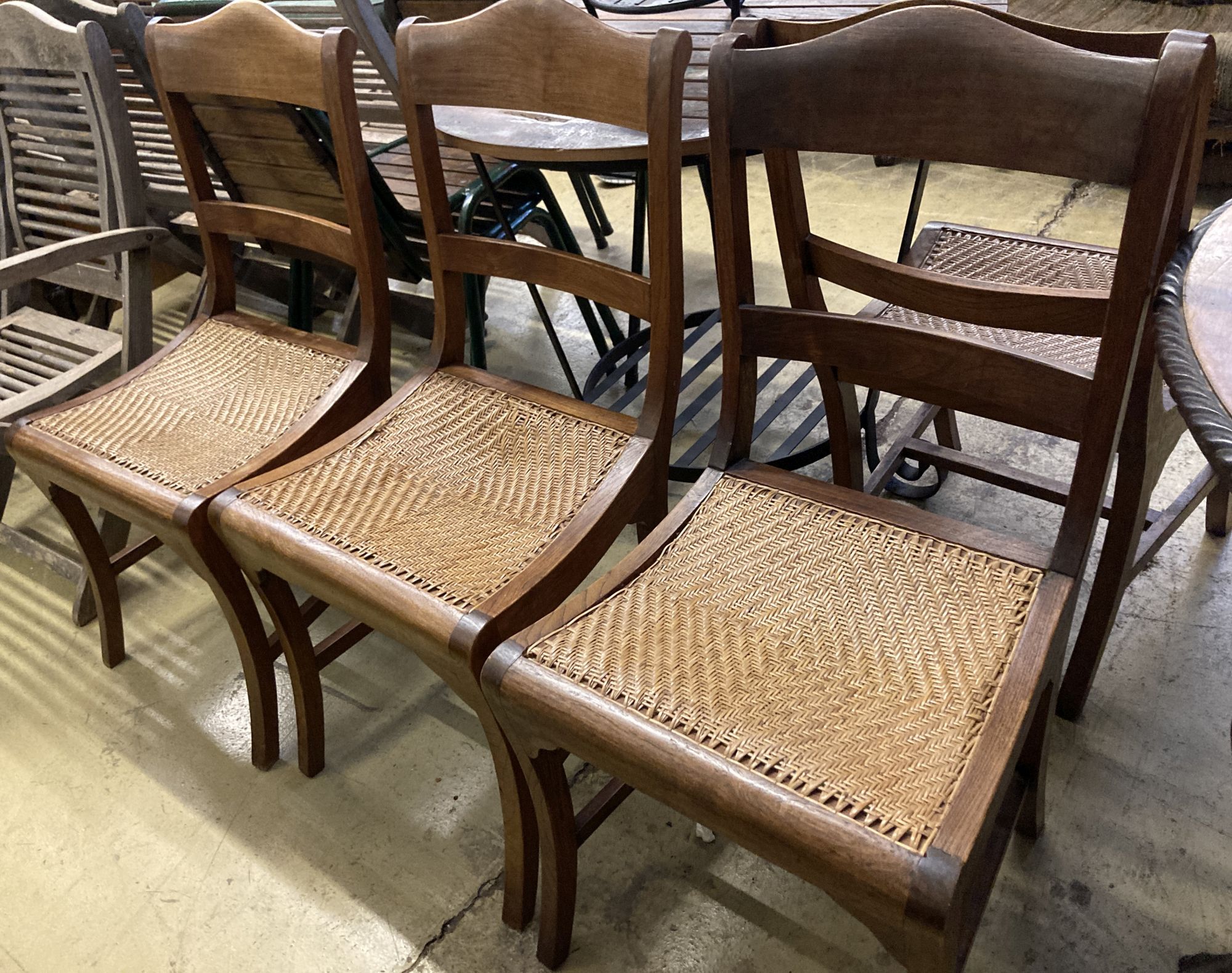 Six Anglo Indian caned hardwood dining chairs